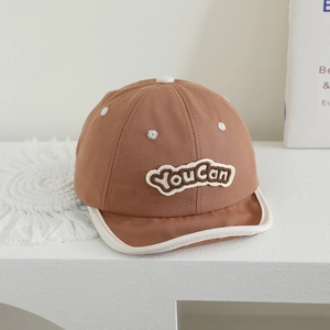 Detail of baby cotton baseball cap with YouCan embroidery and soft white brim edge
