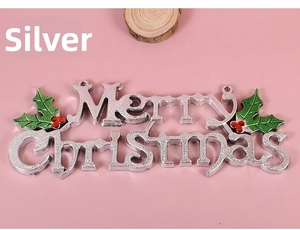 Close-up of silver Merry Christmas door sign with red berries and green leaf accents
