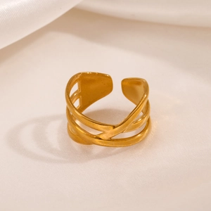 Minimalist gold multi-layer crossover open ring on elegant white silk background