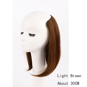 Detail of 30cm light brown U-part hair extension piece on a white model bust