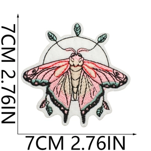 Detail of moth embroidery patch in pink and green showing 7cm 2.76in size dimensions