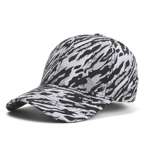 Detail of the quick-dry baseball cap with black and grey tiger stripe camo pattern