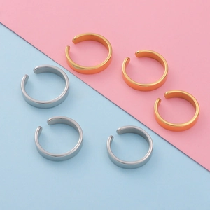 Polished stainless steel C-shaped open rings shown in gold and silver finishes