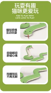 Close-up of green snake cat toy with realistic eyes, red tongue and textured surface