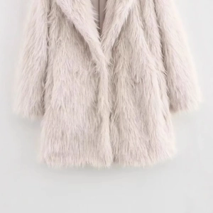 Stylish long faux fur coat for women in elegant light dusty pink, soft fluffy plush texture