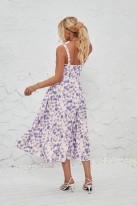 Detail of French sleeveless floral dress back design with side slit and blue floral print