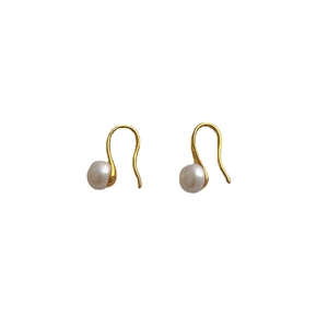 Elegant gold hook earrings featuring white freshwater pearls with minimalist S-curve design