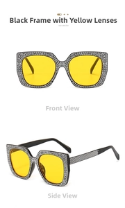 Detail view of oversized sunglasses featuring black frames with yellow lenses and rhinestones