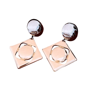 Modern geometric mixed-shape earrings with circular and square rose gold metal charms