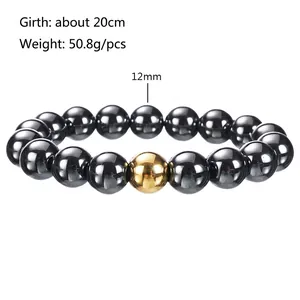 Detail view of 12mm black hematite beads with a gold accent on a 20cm elastic bracelet