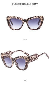 Detail of tortoise shell cat-eye sunglasses with gradient lenses and thick geometric frames