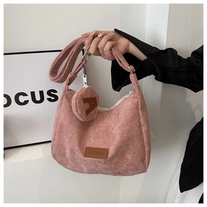 Pink corduroy tote bag with adjustable strap, leather logo patch and round coin purse