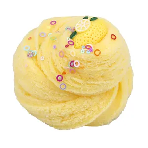 Macro shot of yellow lemon themed slime with colorful sequins and a lemon charm detail