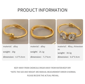 Detailed view of three gold alloy bangles including smooth and rhinestone embellished styles