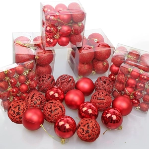Assorted red Christmas ball ornaments in matte, glossy, and glitter hollow designs