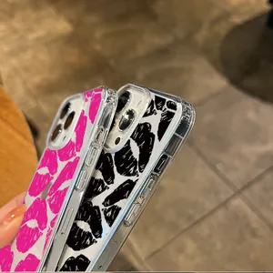 Detail of transparent phone cases with vibrant red and black lip prints for iPhone models