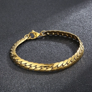 Sleek gold-plated stainless steel curb chain bracelet with lobster clasp on black background