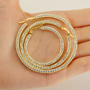 Three pairs of gold-plated hoop earrings with white zircons in different sizes