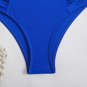 Royal blue bikini bottom with ruched details and high-elastic fabric in flat lay view