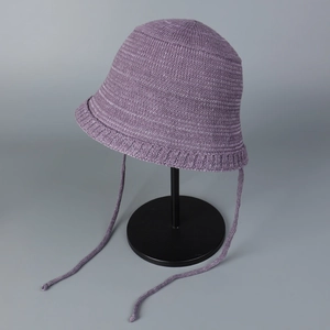 Detail showing the light purple breathable knitted sun hat with wavy brim and tie straps