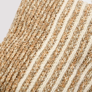 Detailed macro view of soft chenille knit fabric with beige and tan striped texture