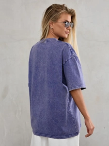 Detail of washed purple cotton T-shirt featuring vintage texture and drop shoulder design