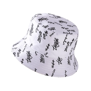 Unisex cotton bucket hat with black graffiti print on white background for sun protection
