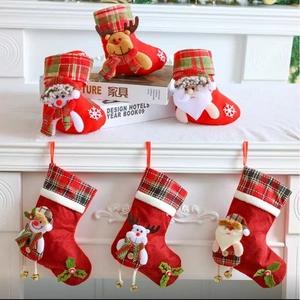 Christmas stocking gift bags with 3D Santa Snowman Reindeer designs for holiday decor