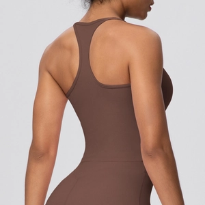 Detail of dark brown racerback yoga vest showing smooth elastic fabric and back muscles