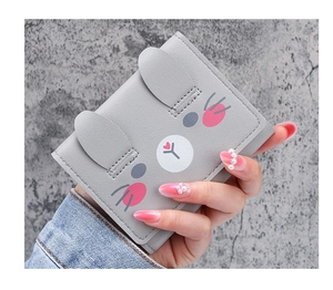 Detail of grey short PU leather wallet with 3D bunny ears and cute animal pattern