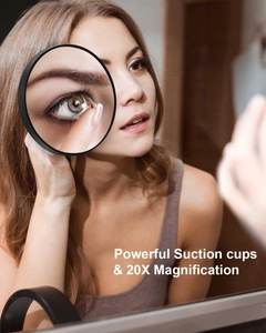 Detail of 20X magnifying mirror with suction cups used for contact lens application