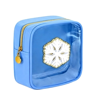 Detail of blue makeup bag with white snowflake patch and golden zipper pendant