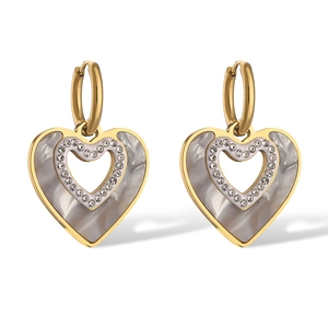 Close-up of heart earrings featuring iridescent shell finish and clear zircon accents
