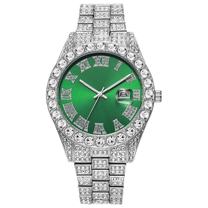 Macro shot of silver crystal-encrusted watch with green dial and Roman numerals