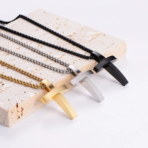 Minimalist stainless steel cross necklaces in gold, silver, and black finish on stone