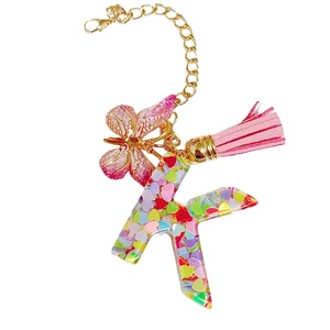 Pink initial K keychain with butterfly charm and colorful sequins for women's bags