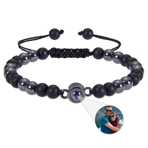 Detail of beaded photo projection bracelet featuring matte black stones and custom picture zoom