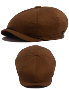 Detailed side view of a vintage dark brown newsboy cap with classic metal buckle and strap