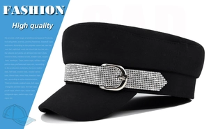 Close-up of a black sailor cap featuring a rhinestone band and silver metallic buckle