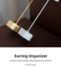 Close-up of minimalist gold and silver metal jewelry stands for earring display