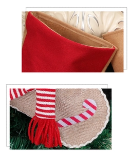 Detail of gingerbread man Christmas stocking featuring red canvas, burlap and knit textures