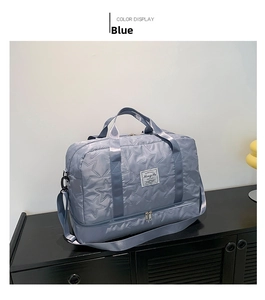 Detail view of the blue quilted travel bag with star pattern and separate shoe compartment