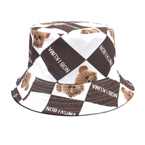 Detail of checkered bucket hat with brown white grid and printed teddy bear design