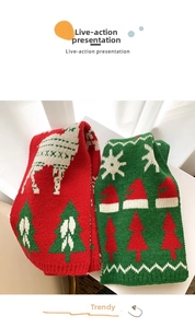 Close-up of knit patterns featuring reindeer and Christmas trees on thick warm scarves