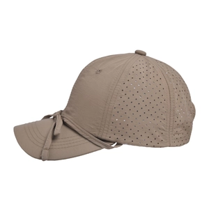 Detail of tan quick-dry baseball cap featuring breathable laser-cut holes and side bow knot