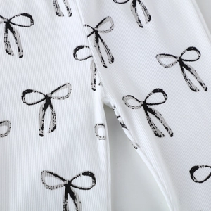 Leggings en maille côtelée blanche pour filles avec motifs nœuds noirs, pantalon en coton
