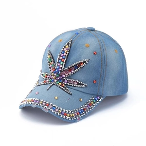 Light blue denim baseball cap featuring colorful rhinestone leaf patterns on the front