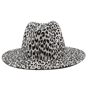 Detail of a white leopard print fedora hat showing the wool felt texture and flat brim