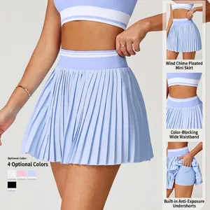Women's pleated high-waist light blue tennis skirt with built-in shorts and side pocket