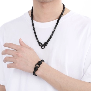 Close-up of rock style black stainless steel dragon head necklace and bracelet set